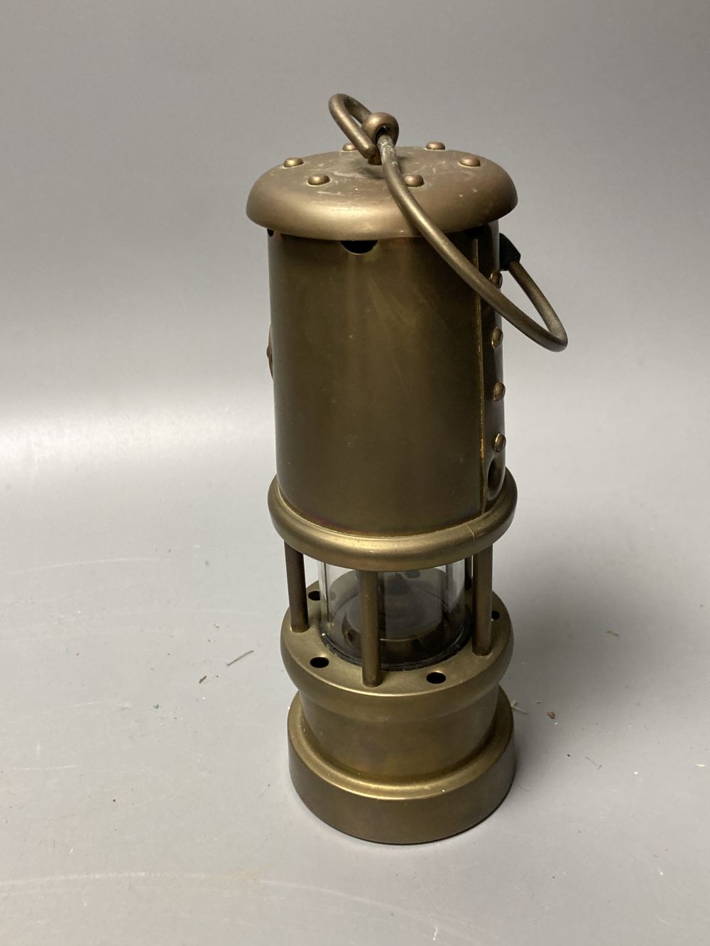 Three brass and chrome miners lamps, 25cm high